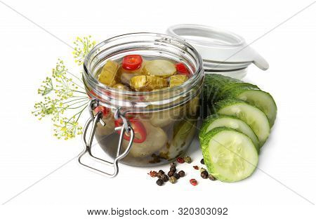 Jar With Pickled Cucumbers On White Background