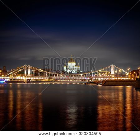 Night View At The Main Russian Cathedral Of Christ The Savior And The Krymsky Bridge From The Embank