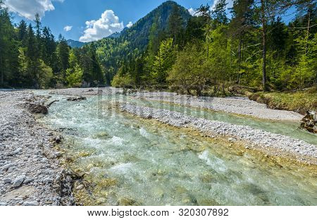Beautiful Landscape Scene With Forest, Mountains And River In Slovenia, Europe.