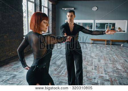 Dancers in costumes on ballrom dance training