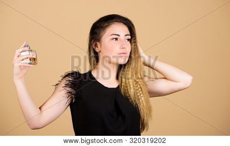Share The Fantasy. Girl Applying Perfume. Luxury Lotion. Woman With Bottle Of Perfume. Beauty Produc