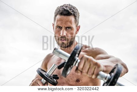 Man Sportsman Weightlifting. Steroids. Success. Perfect Biceps. Fitness And Sport Equipment. Athleti