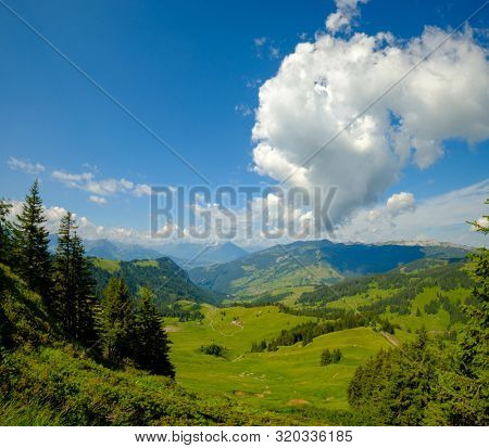 Summer time mountain panoramic landscape in Switzerland near Habkern village