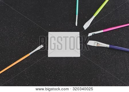 Mini Blank Canvas And Paintbrush With Copyspace