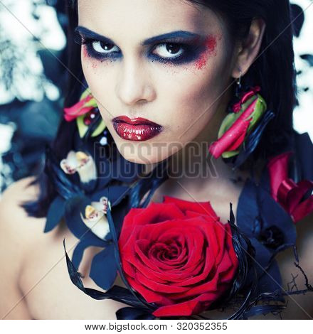 Pretty Brunette Woman With Rose Jewelry, Black And Red, Bright Make Up Kike A Vampire Closeup Red Li