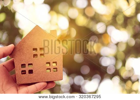 Copyspace Model Of A Little House That Woman Holds It Background.