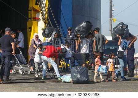 Refugees And Migrants Disembark To The Port Of Thessaloniki After Being Transfered From The Refugee