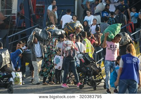 Refugees And Migrants Disembark To The Port Of Thessaloniki After Being Transfered From The Refugee