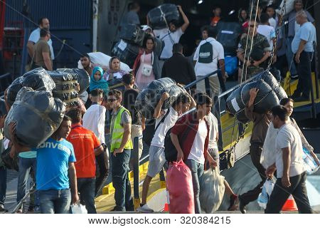 Refugees And Migrants Disembark To The Port Of Thessaloniki After Being Transfered From The Refugee