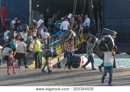 Refugees And Migrants Disembark To The Port Of Thessaloniki After Being Transfered From The Refugee