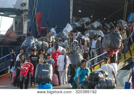 Refugees And Migrants Disembark To The Port Of Thessaloniki After Being Transfered From The Refugee