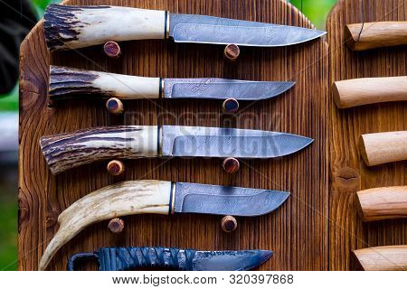 Knives Of Different Shapes With The Blade Metal And Handle Made Of Bone Or Plastic