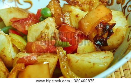 Punjabi  Shimla Mirch Aloo, Indian Dish Prepared With Potatoes And Green Pepper Cooked In A Tomato G
