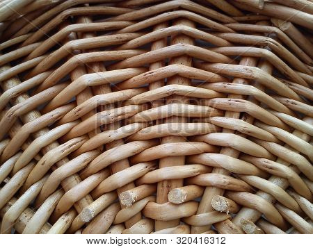 Close-up Of Natural Beige Wicker Plexus At The Bottom Of A Traditional Folk Basket In Warm Colors