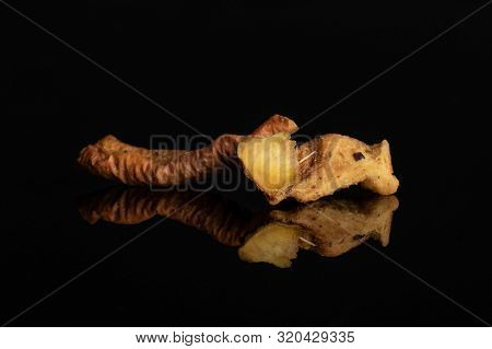 Group Of Two Pieces Of Orange Rind With Roseship Of Lingonberry Strawberry Fruit Tea Macro Isolated 