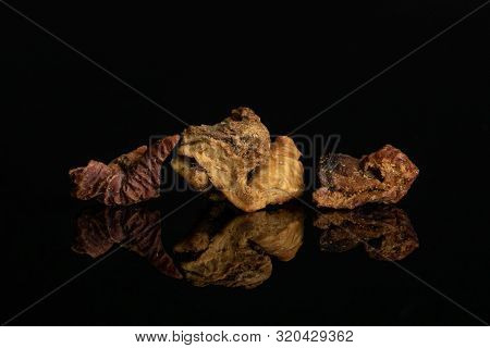Group Of Three Pieces Of Roseship With Orange Rind Of Lingonberry Strawberry Fruit Tea Macro Isolate