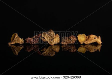 Group Of Five Pieces Of Roseship With Orange Rind Of Lingonberry Strawberry Fruit Tea Macro Isolated