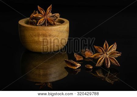 Group Of Lot Of Whole Four Pieces Of Dry Brown Star Anise Illicium Verum In Tiny Wooden Bowl Isolate