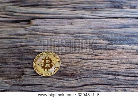 Digital Currency Physical Metal Bitcoin Coin On The Old Wooden Table