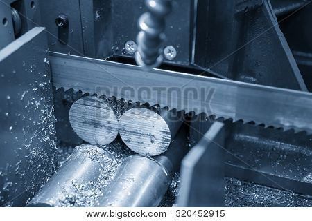 The Operation Of Band Saw Machine Cutting The Metal Rod. The Ingot Material Preparation For Machinin