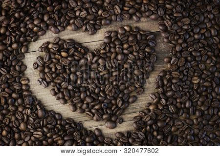 Coffee Beans Background. Organic Coffee. Roasted Coffee Beans. Coffee Beans On A Wooden Background I