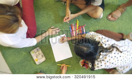 The Concept Of Childrens Group Psychotherapy. Female Psychologist Conducts A Group Consultation With