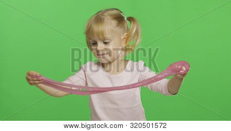 Child Having Fun Making Ping Slime. Kid Playing With Hand Made Toy Slime. Funny Kid Girl. Relax And 