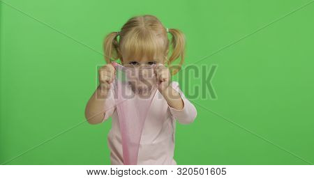 Child Having Fun Making Ping Slime. Kid Playing With Hand Made Toy Slime. Funny Kid Girl. Relax And 