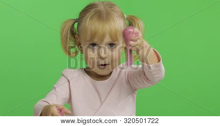 Child Having Fun Making Ping Slime. Kid Playing With Hand Made Toy Slime. Funny Kid Girl. Relax And 