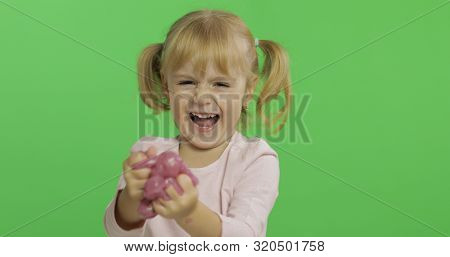 Child Having Fun Making Ping Slime. Kid Playing With Hand Made Toy Slime. Funny Kid Girl. Relax And 