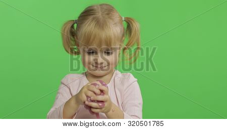 Child Having Fun Making Ping Slime. Kid Playing With Hand Made Toy Slime. Funny Kid Girl. Relax And 