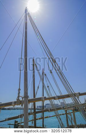 Ropes And Spars Of Traditional Rigging Of Dhow Moored Along The Corniche, Doha Old Town Waterfront W