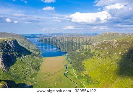 Aerial View Of The Glenveagh National Park With Castle Castle And Loch In The Background - County Do