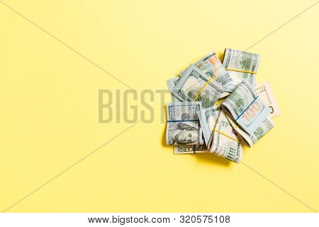 Stacks Of One Hundred Dollars Banknotes Close-up On Colored Background Business Concept Top View Wit