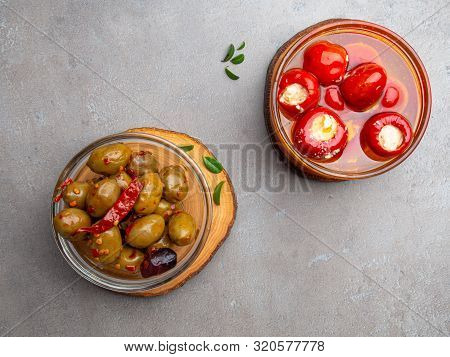 Italian Food Ingredients Background With Olives, Oil Red Stuffes With Cheese Bell Peppers