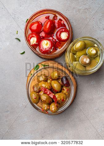 Italian Food Ingredients Background With Olives, Oil Red Stuffes With Cheese Bell Peppers
