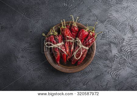 Spicy Chili On A Dark Background In Ceramic Plates, Flatlay. Used As An Ingredient For Harissa, Ajik