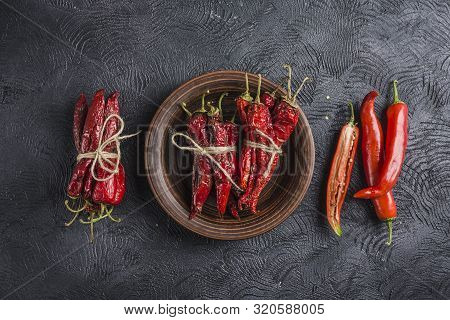 Spicy Chili On A Dark Background In Ceramic Plates, Flatlay. Used As An Ingredient For Harissa, Ajik