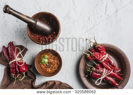 Spicy Chili On A Light Background, Flatlay. Used As An Ingredient For Harissa, Ajika, Muhammara. Eas