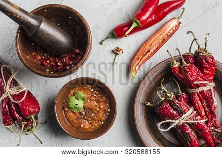 Spicy Chili On A Light Background, Flatlay. Used As An Ingredient For Harissa, Ajika, Muhammara. Eas
