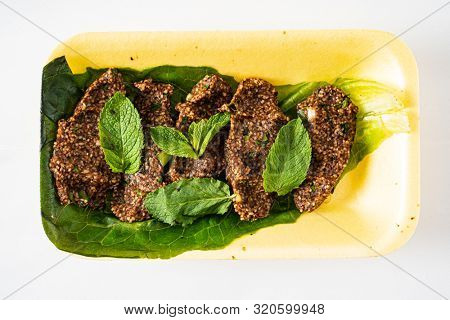 traditional Turkish cutlets (Ãi? kÃ¶fte) 