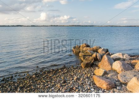 Scenic Stony Beach And Rocks At The Baltic Sea At Sunset