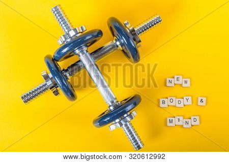 Healthcare Concept Showing Dumbbells And The Message New Body & Mind