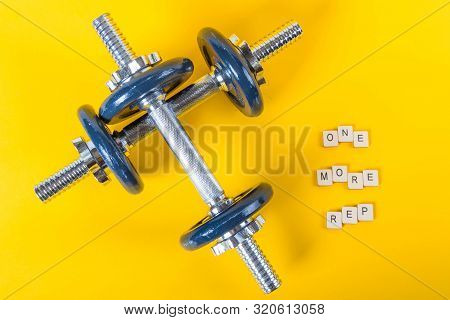 Healthcare Concept Showing Dumbbells And The Message One More Rep