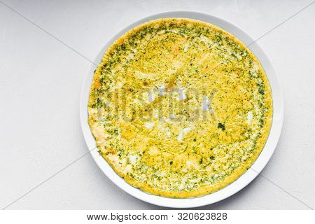 Fried Eggs And Seasoning. Amlet On A Round Plate. View From Above. Place For Writing