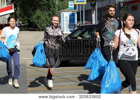Plogging. Young People Are Happy That They Managed To Collect City Garbage. Saratov, Russia, 10 June