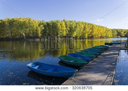 Closed Boat Station On The Pond In The Fall.