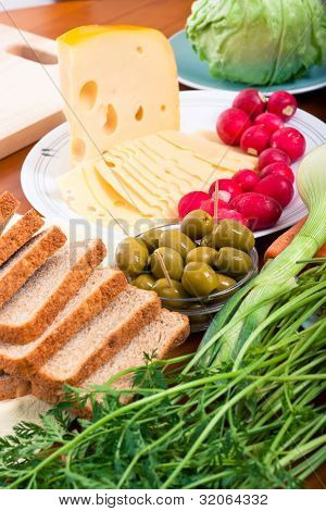 Emmenthal Cheese, Olives, Bread And Vegetable