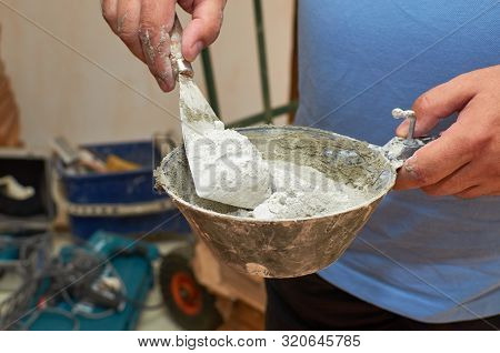 Scraper And Plasterer's Scoop With Gypsum Powder