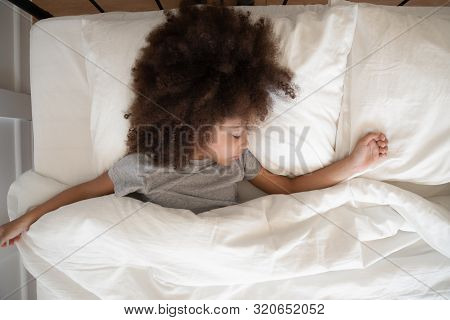 Top View Adorable Little African American Kid Girl Sleeping Alone.